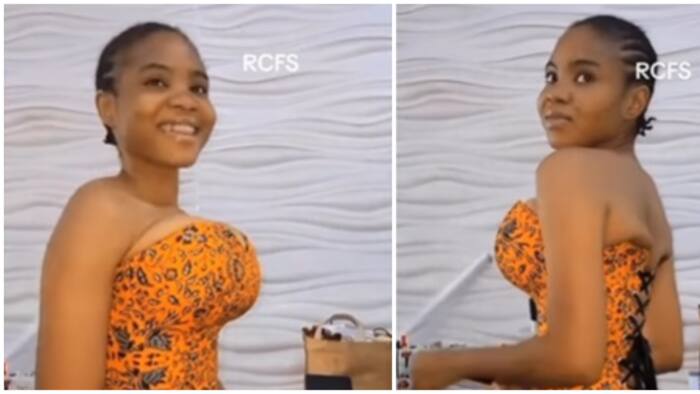 Ankara fashion: Video of lady in tight corset top leaves netizens scratching their heads