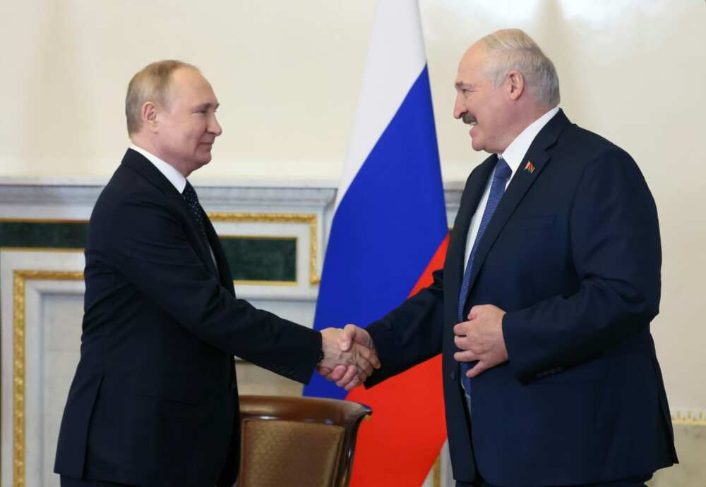 Russian President Vladimir Putin (L) and Belarusian counterpart Alexander Lukashenko at their Saturday meeting in Saint Petersburg Russian President Vladimir Putin (L) and Belarusian counterpart Alexander Lukashenko at their Saturday meeting in Saint Petersburg