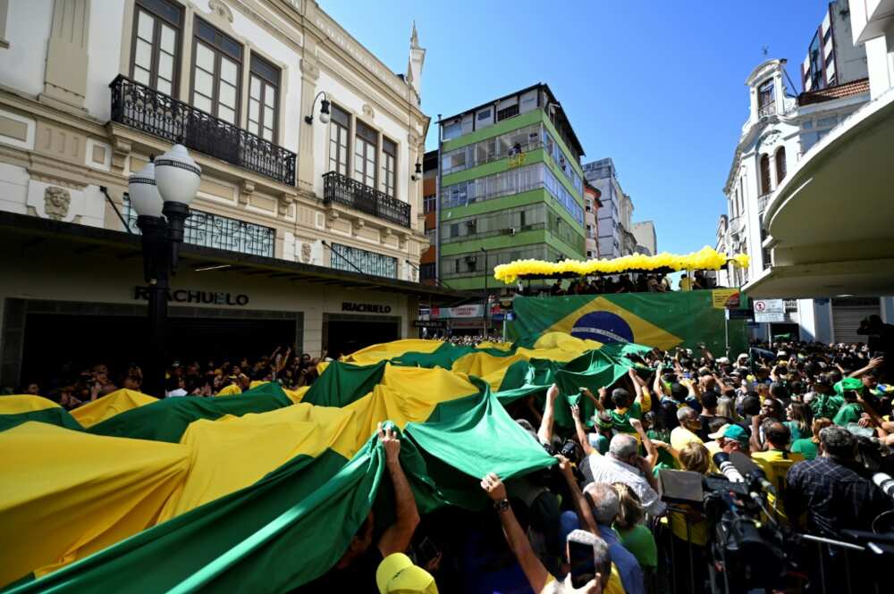 Supporters of Brazil's President Jair Bolsonaro  celebrate the launch of the embattled far-right incumbent's bid for a second term in Juiz de Fora, in the state of  Minas Gerais, Brazil, on August 16 2022