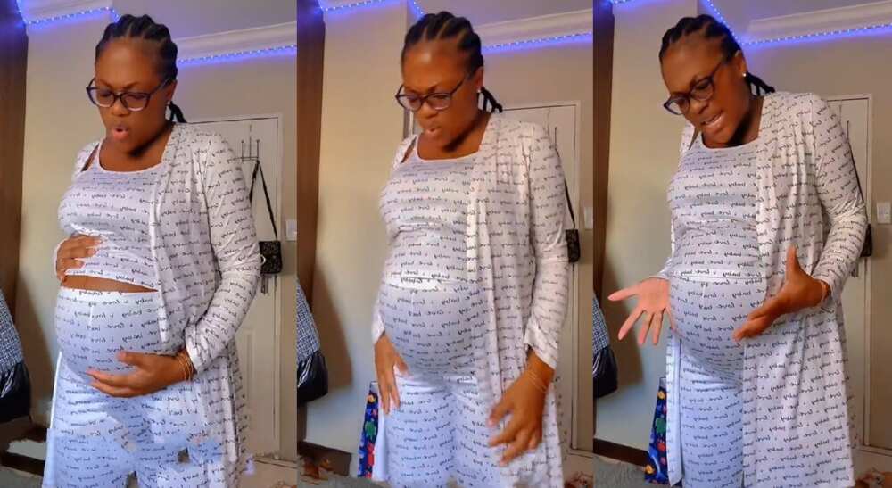 Photos show pregnant woman touching her baby bump.