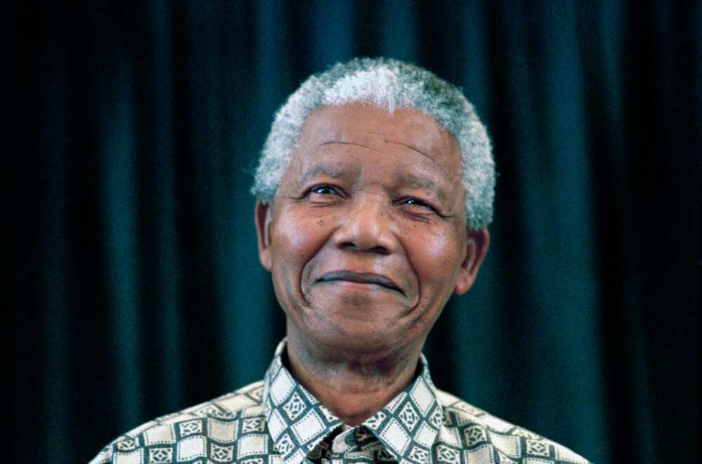 Former President Nelson Mandela of South Africa in a green and white shirt