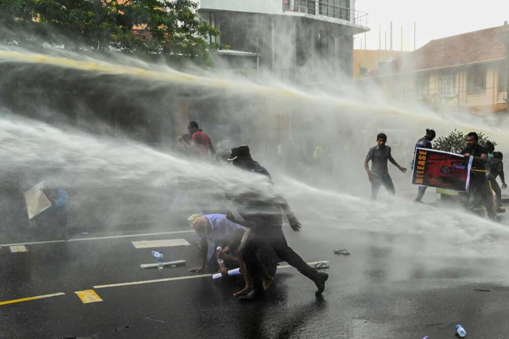 Police use water cannon to disperse demonstrators in Colombo on Tuesday
