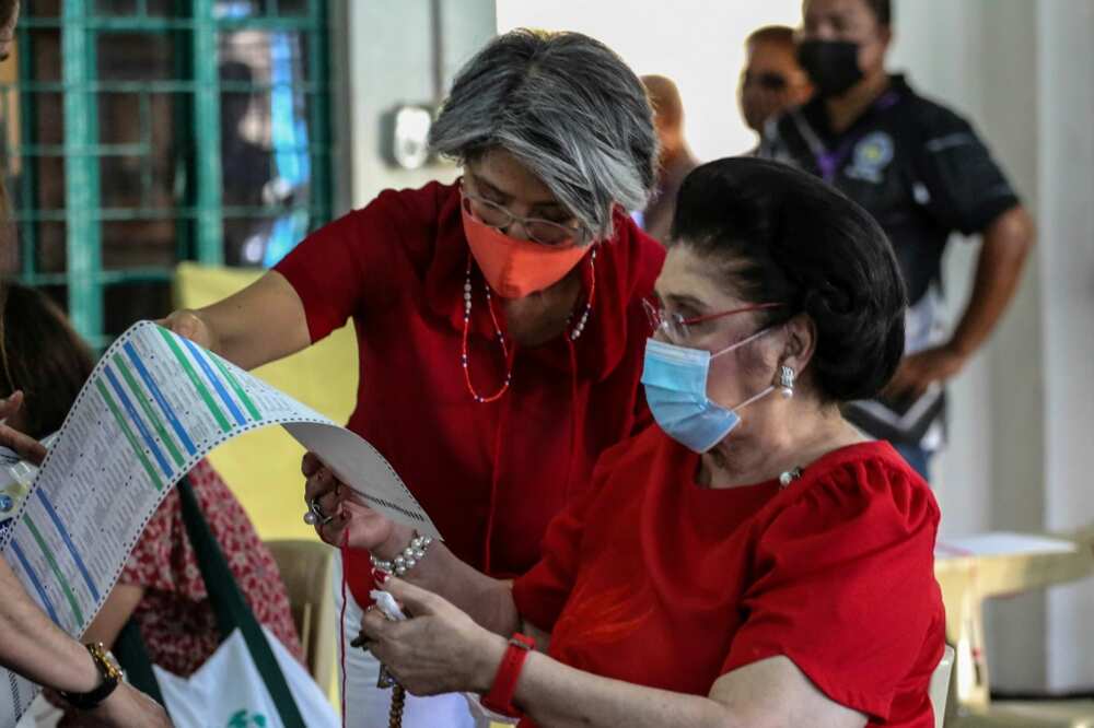 Imelda Marcos (shown here voting in the May 2022 election), the mother of incoming Philippine president Ferdinand Marcos Jr, was a powerful first lady before her husband was ousted from power in 1986 Imelda Marcos (shown here voting in the May 2022 election), the mother of incoming Philippine president Ferdinand Marcos Jr, was a powerful first lady before her husband was ousted from power in 1986