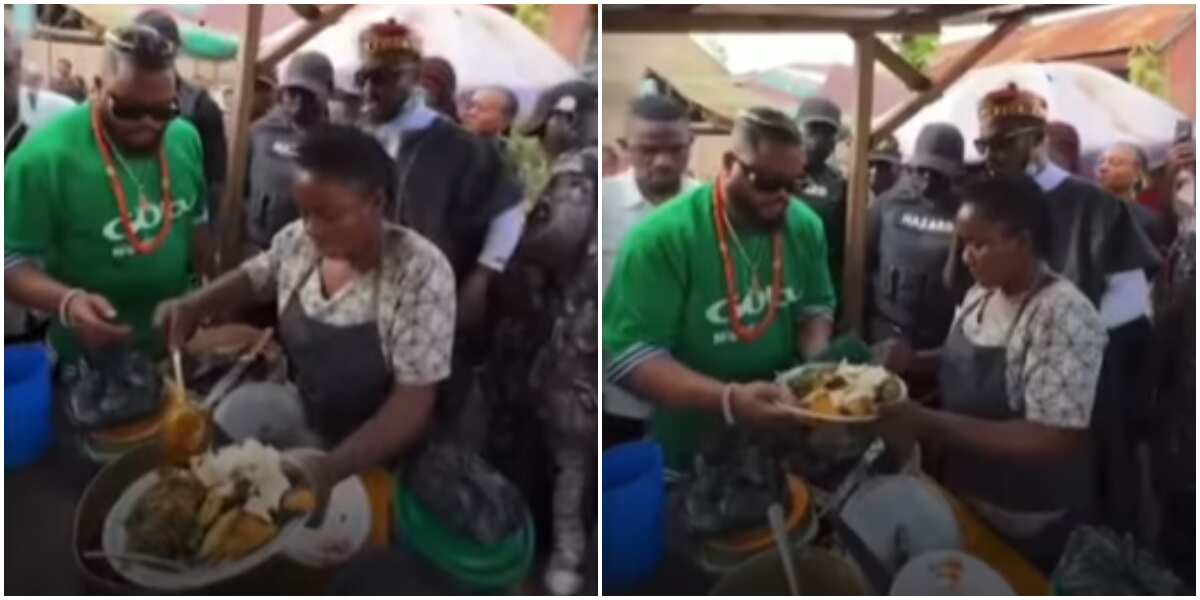 Reactions as video shows Whitemoney buying roasted yam at roadside shed in Enugu with full security team