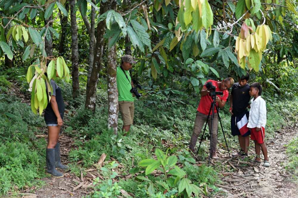 Tikuna indigenous filmmakers film documentary short films with the support of Matis indigenous filmmakers in San Martin de Amacayacu, Colombia, on October 14, 2022