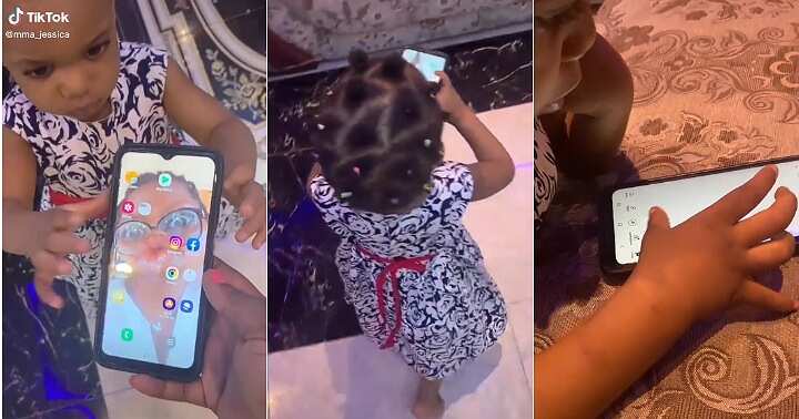 Little girl plays with phone, operates phone like adult, Baby Shark video