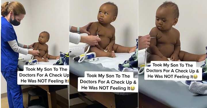 Little boy stares at doctor, serious look