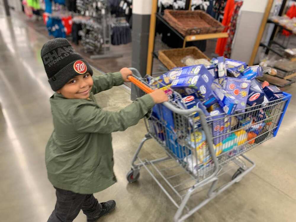 Kind 7-year-old boy delivers care packages to elderly people who can't leave houses due to COVID-19