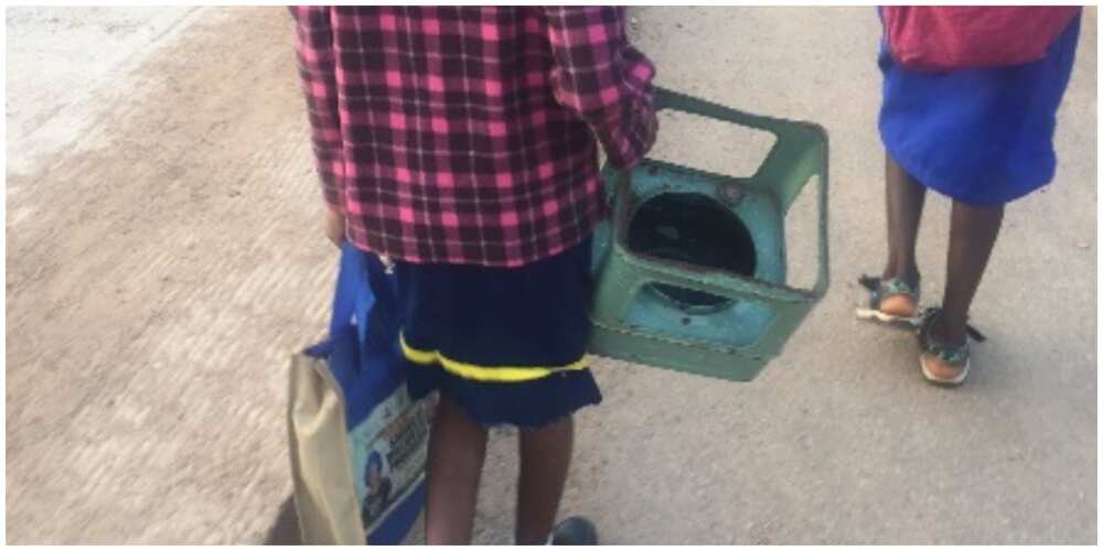 Nigerians react to photo of student going to school with a stove frame to be used as a chair