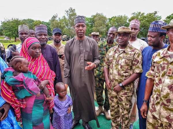 Zulum taking custody of Hassana in Gwoza town