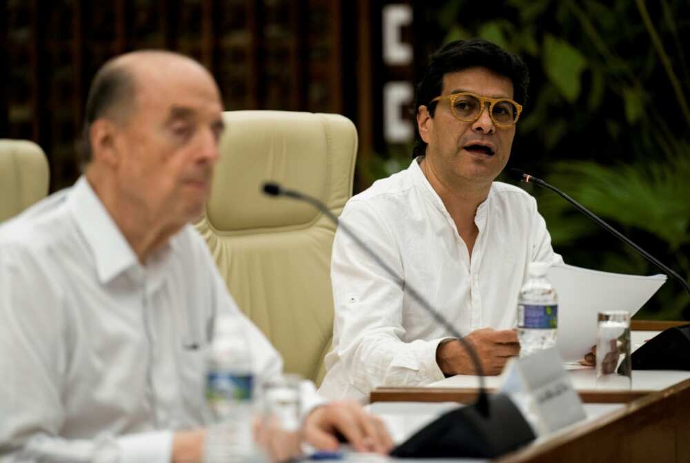 Colombian High Commissioner for Peace, Ivan Danilo Rueda (right), reads a statement with Colombian Foreign Minister Alvaro Leyva, during a meeting with an ELN guerrilla delegation, in Havana