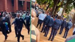 Video shows teary moment colleagues of security man, 37, followed him as he graduated from school