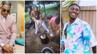 "He almost fainted": Zlatan Ibile goes shirtless as he pounds yam with energy, village women outshine rapper