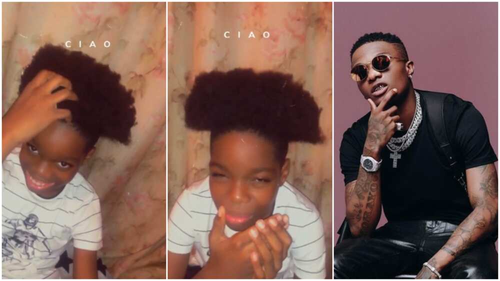 Wizkid's son Tife rocks new hairstyle in viral video, covers his face in shyness