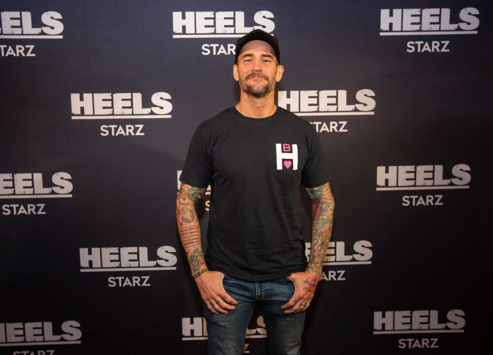 CM Punk pose for a photo during a screening episode of the Heels