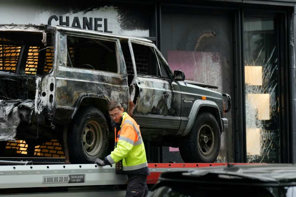 Four people are suspected of taking part in the ram-raid burglary of a Chanel store in Paris.