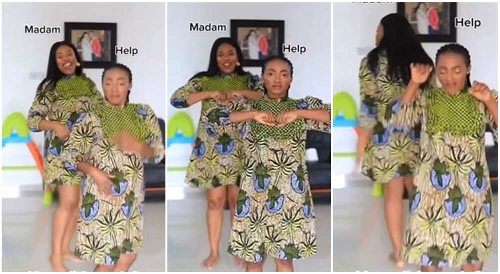 Madam and her housemaid, dressed in Ankara gown, dancing.