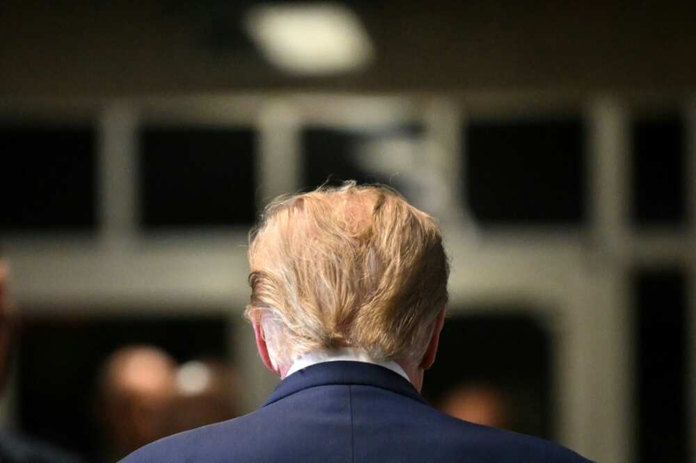 Former US President Donald Trump walks to the courtroom after speaking to the press at Manhattan Criminal Court in New York City on February 15, 2024