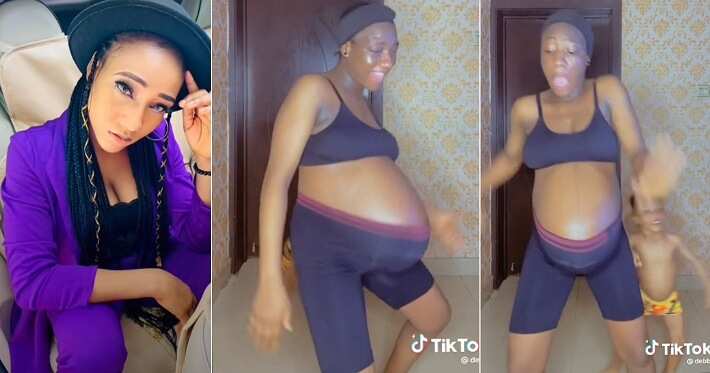 Pregnant woman dances with baby bump