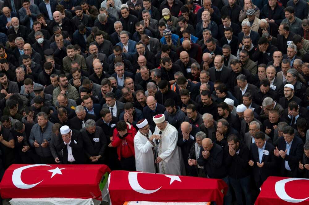 Hundreds of people gathered as an imam led the funeral service