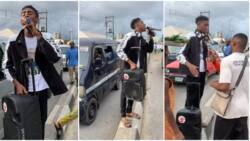 "We don tire": Young man takes loudspeaker to market, preaches about voting and PVC, Nigerians listen in video