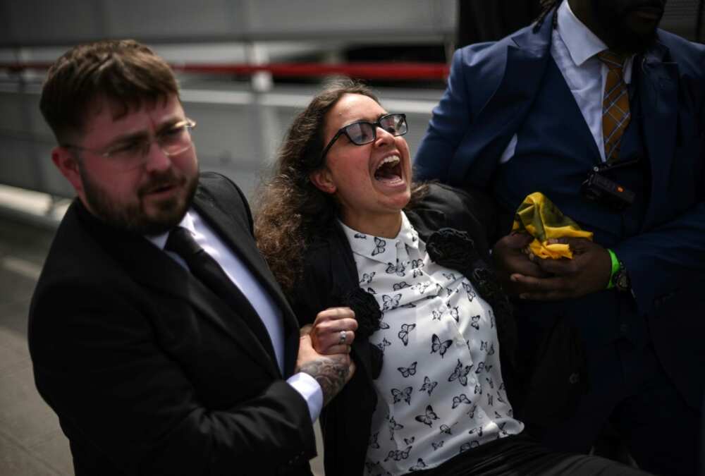 More than 100 activists disrupted the start of the shareholders' meeting before being escorted out by security