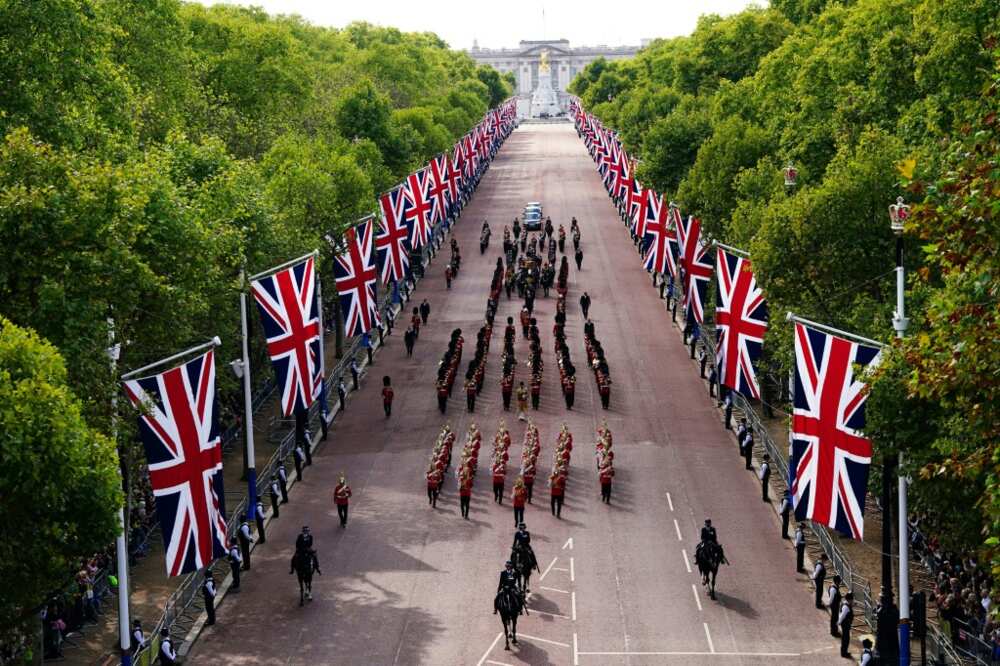 The queen's lying in state follows a grand procession through the flag-lined heart of London