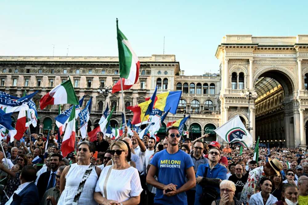 Supporters of Giorgia Meloni, leader of Italy's far-right Brothers of Italy party, attend a campaign rally in Milan
