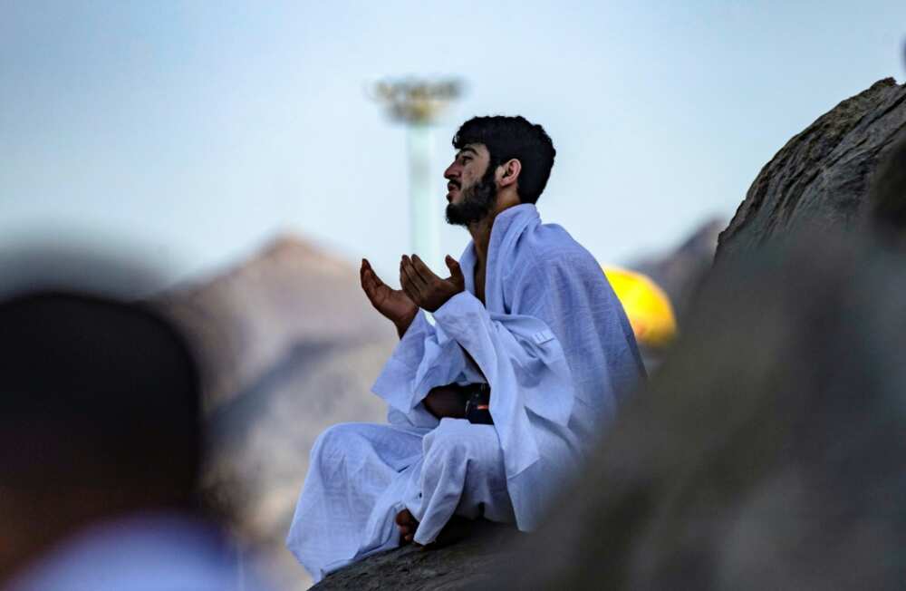 A Muslim pilgrim prays atop Mount Arafat, southeast of the holy city of Mecca, during the climax of the Hajj pilgrimage