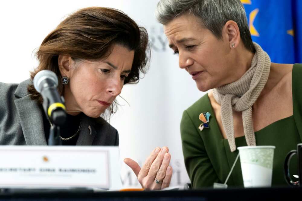US Secretary of Commerce Gina Raimondo (L) speaks with European Commission Executive Vice President Margrethe Vestager (R) as they participate in a US-EU dialogue on December 5, 2022