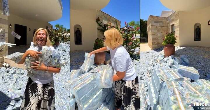 Woman flaunts bundles of cash in her compound