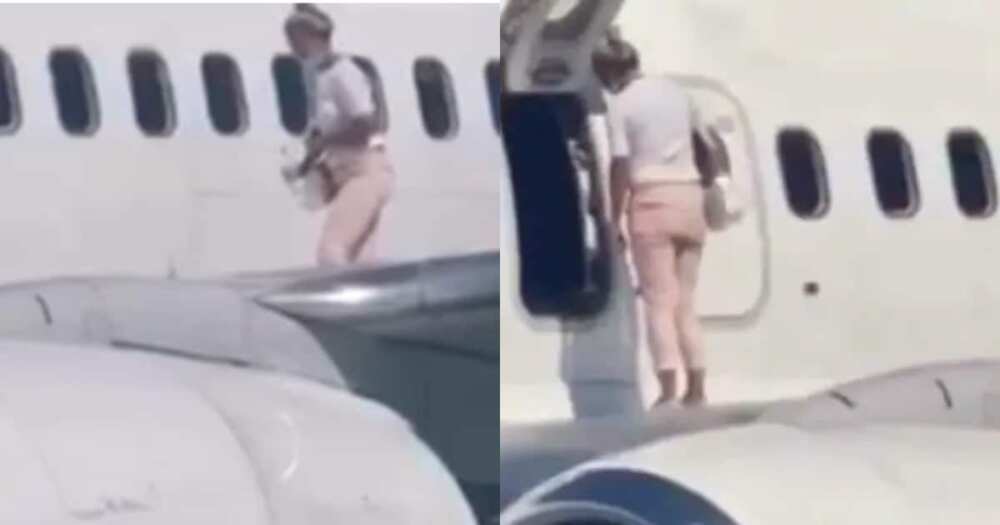 Woman opens plane emergency exit, climbs onto wing after complaining she felt hot