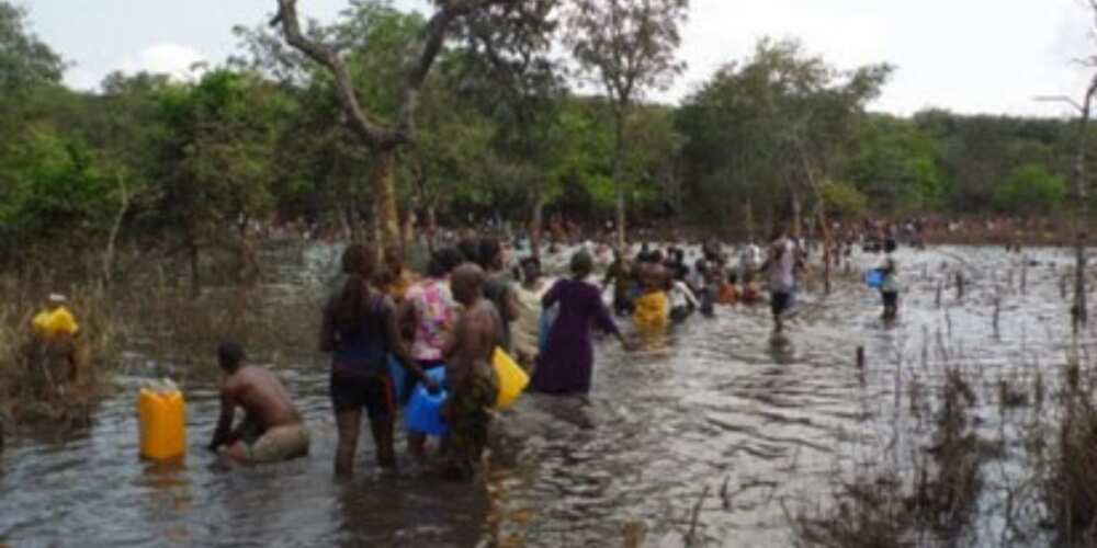 People fetch water from Miracle Stream