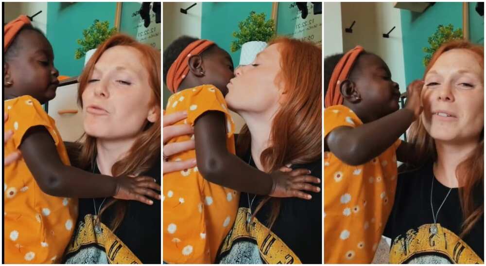 Photos of a white woman plaing with her adopted black kid. Photos of a white woman plaing with her adopted black kid.
