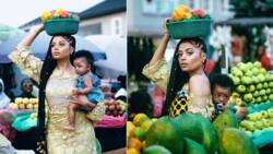 I have the best present on my back - Tekno’s baby mama Lola Rae says as she carries child in market-themed birthday photos