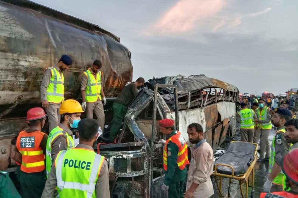 At least 20 people were killed when a bus caught fire after colliding with an oil tanker in Pakistan At least 20 people were killed when a bus caught fire after colliding with an oil tanker in Pakistan
