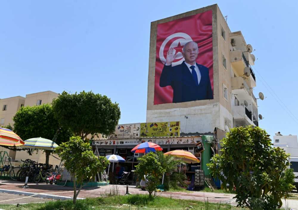 A billboard depicting Tunisia's President Kais Saied hangs on the side of a building in the central city of Kairouan, on July 26, 2022 A billboard depicting Tunisia's President Kais Saied hangs on the side of a building in the central city of Kairouan, on July 26, 2022