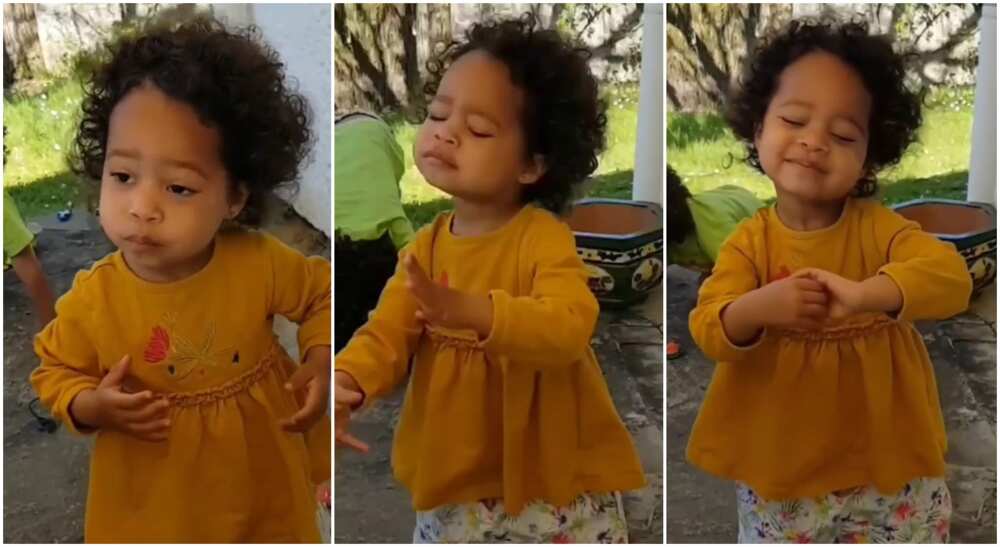 Photos of a little girl dancing to One Love by Bob Marley.