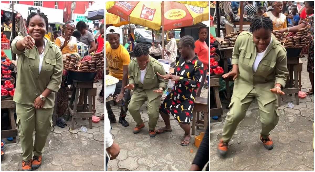 Cute lady in NYSC uniform jumps on Buga challenge inside market, traders, smoked fish seller joins in video