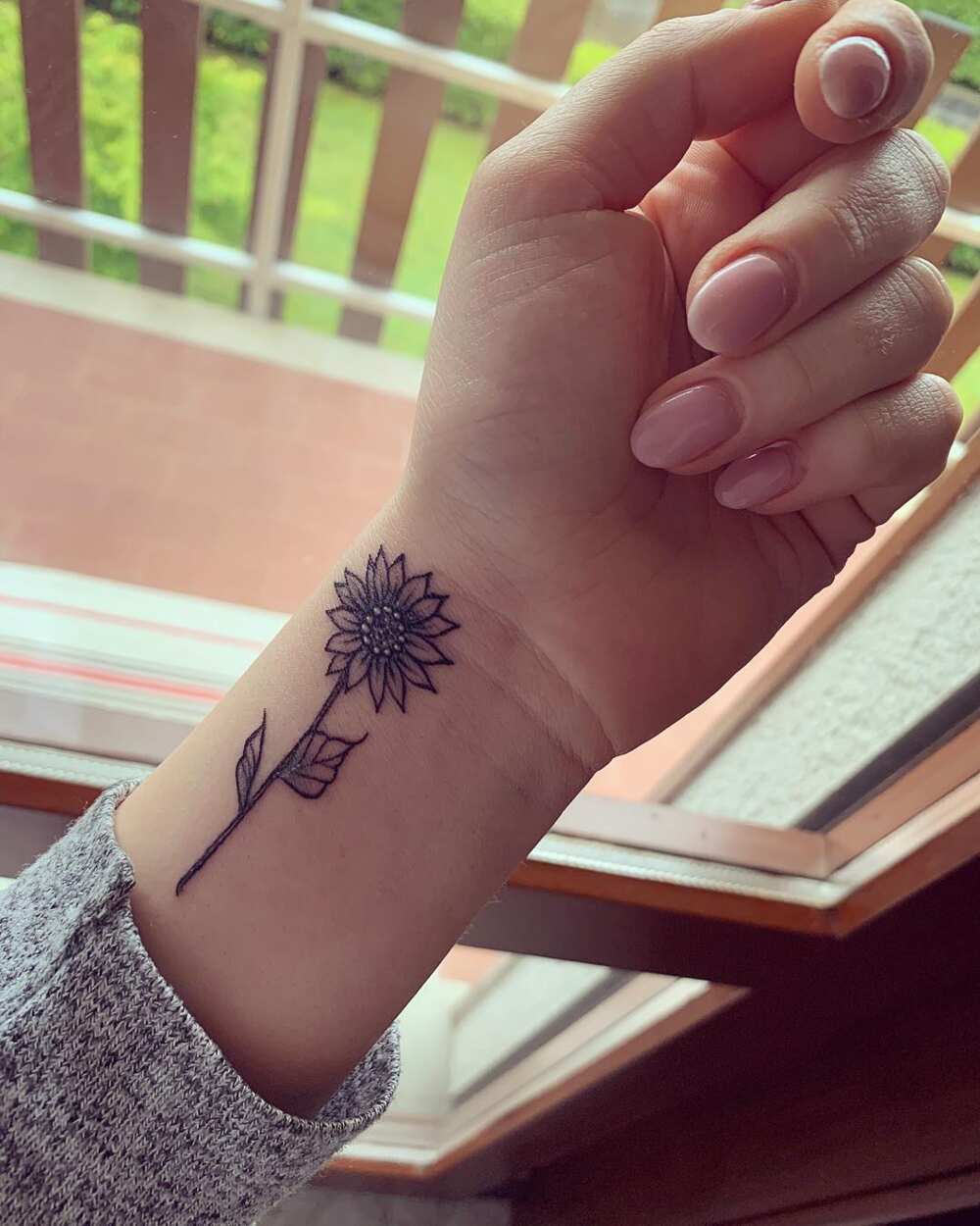 sunflower wrist tattoo