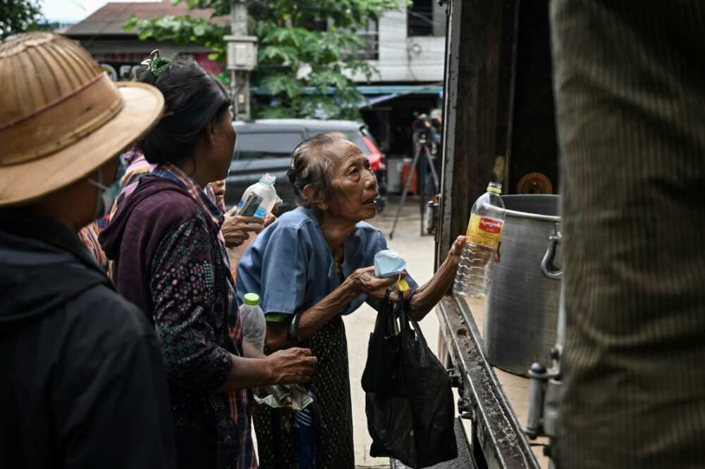 Yangon residents queue to buy cheap vegetable oil as prices spike in Myanmar