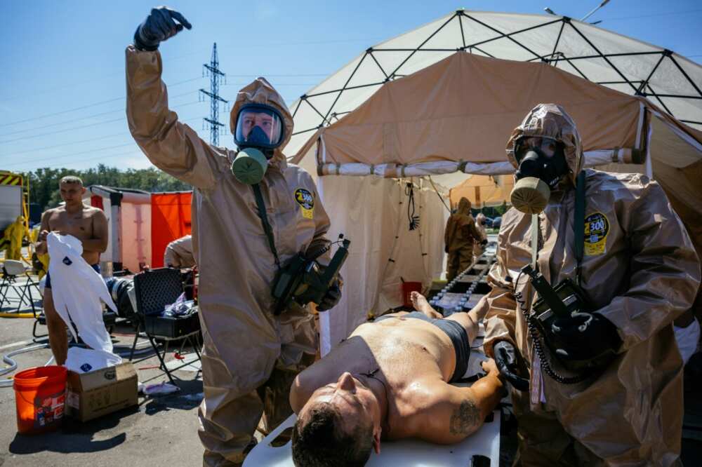 Rescuers take part in an exercise simulating a nuclear incident at the Zaporizhzhia plant on Wednesday