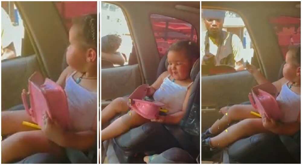 Beautiful baby girl sits in car like adult, offers cash to begger.