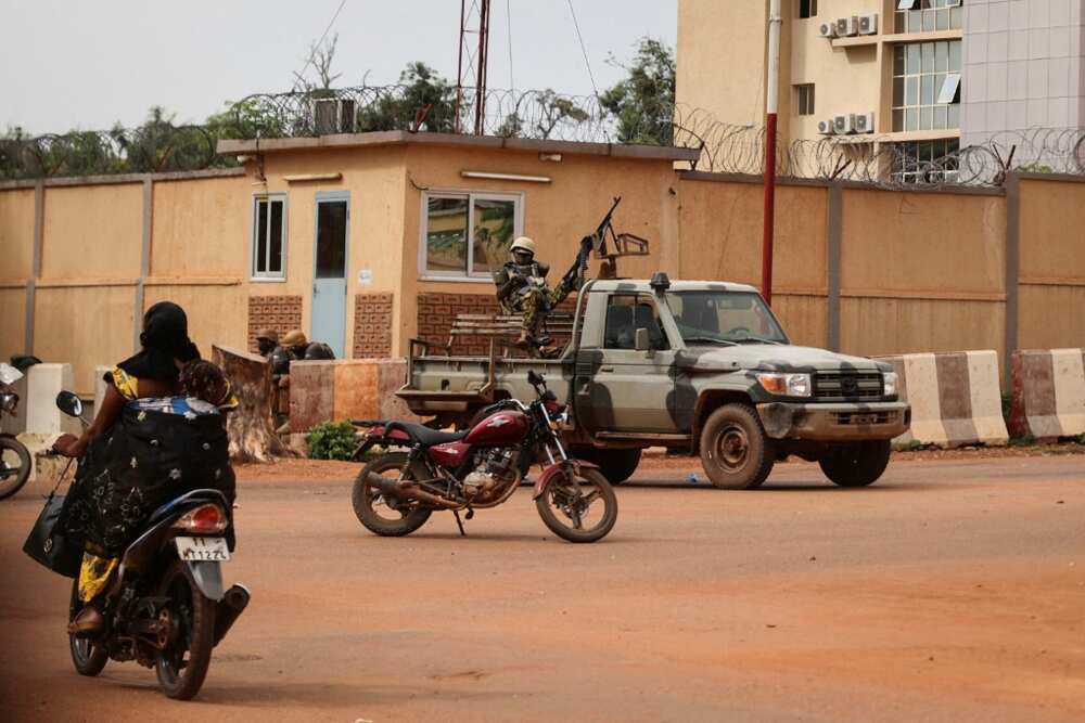 Soldiers patrol the streets of Ouagadougou after shots rang out during the morning