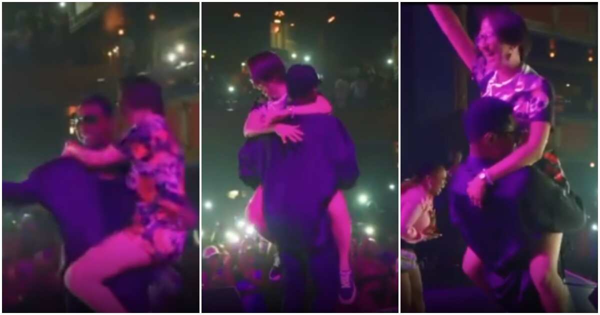 Fans go wild as Kizz Daniel carries oyinbo fan like a baby on stage, video goes viral, Nigerians react