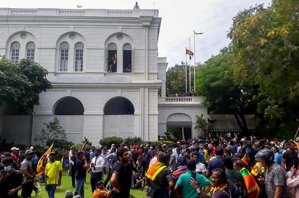 Sri Lanka leader flees as protesters storm home