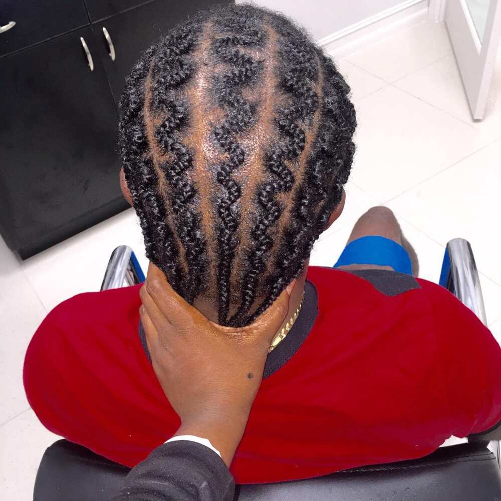 Cornrows with slalom-like weaving Cornrows with slalom-like weaving