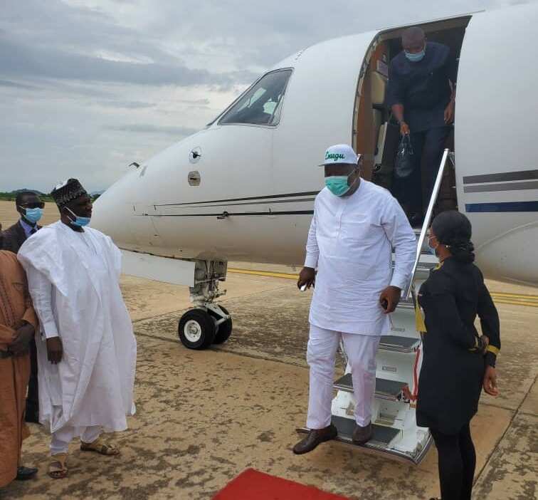 Governor Ugwuanyi getting down from an aircraft