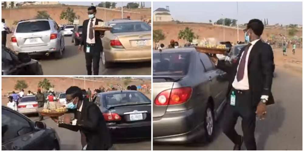 24-Year-Old Nigerian Man who Hawks Kolanuts Dressed in Suit during Traffic Finally Speaks, Says he Loves it