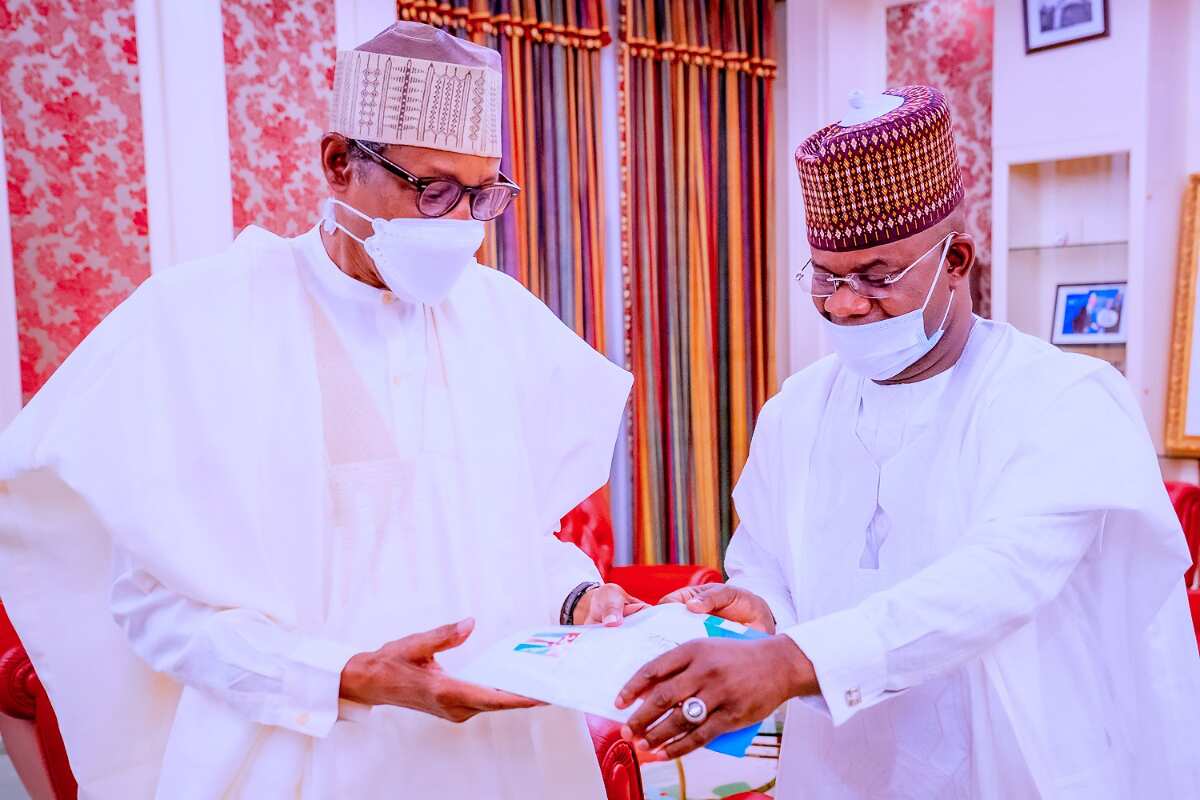 2023: Photos of Yahaya Bello presenting APC form before Buhari in Aso Rock sparks mix reactions